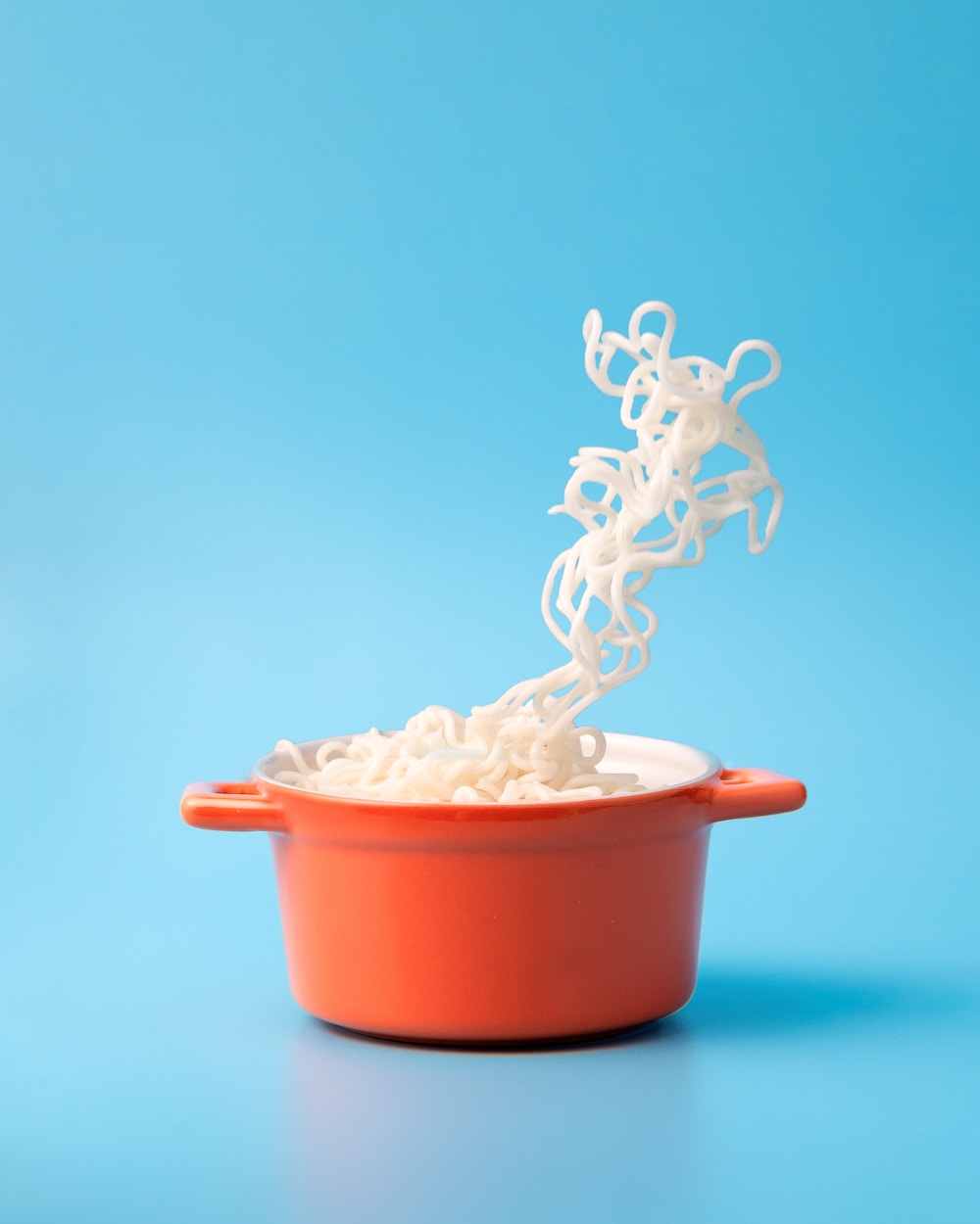 Noodles in an orange pot