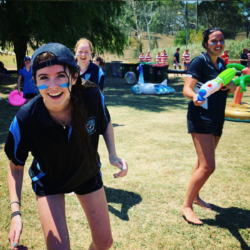 group of students having a waterfight