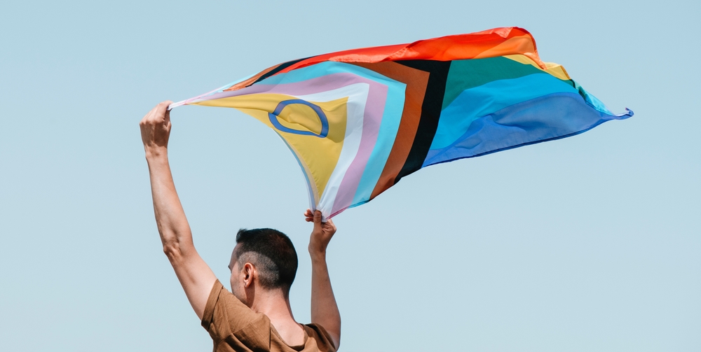 A,Man,Waves,An,Intersex Inclusive,Progress,Pride,Flag,Above,His